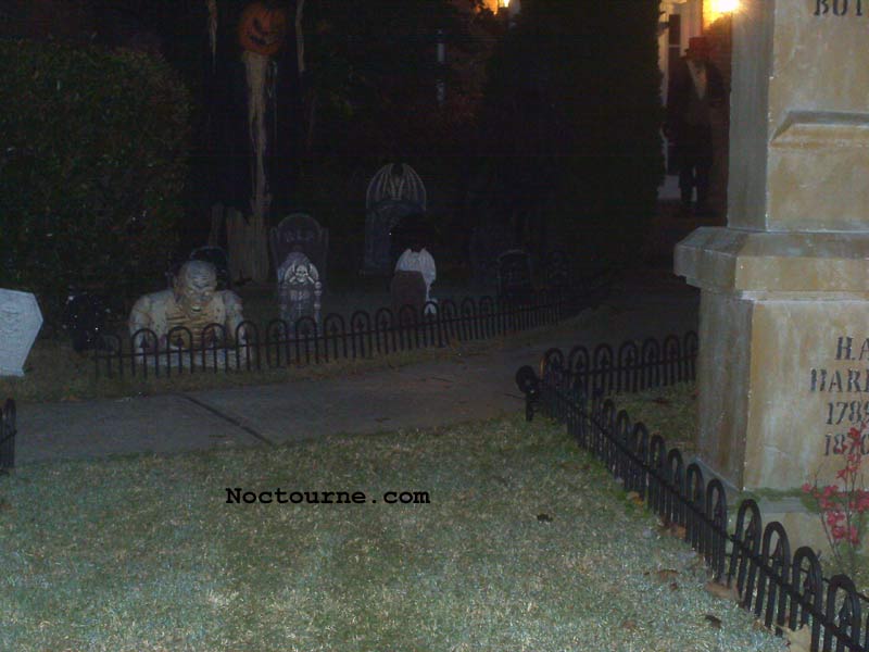 Night View of our Halloween Graveyard Skull Orchard Cemetery with Grave Yard Ghoul and Sleepy Hollow Scarecrow