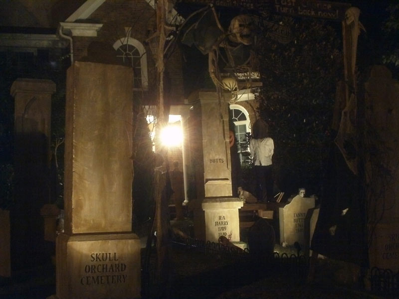 Night View of Halloween Graveyard Entrance Bat Skeleton Skull Orchard Cemetery