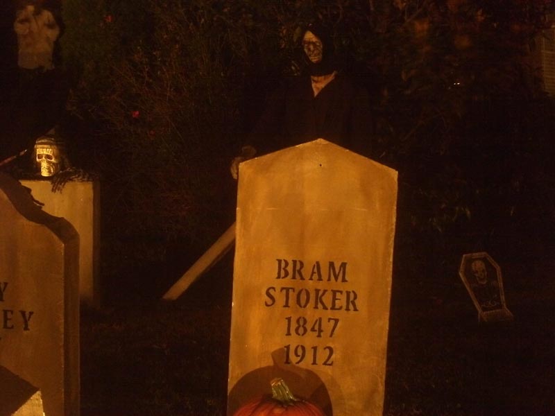 Night View of Halloween Graveyard Cemetery with Crypt Ghoul Bram Stoker Head Stone