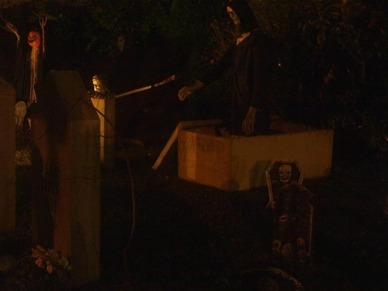 Night View of Halloween Graveyard Cemetery with Crypt Ghoul