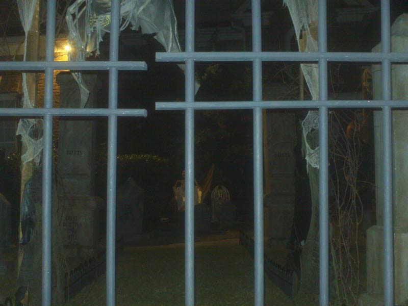 Night View of Halloween Graveyard Cemetery with Crypt Ghoul