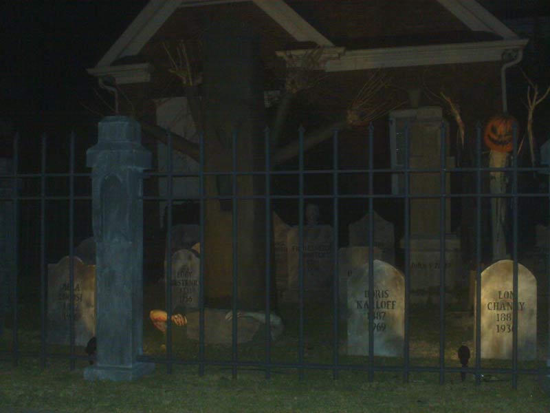 Night View Halloween Graveyard Cemetery with Gallows Executioner Plus Various Grave Yard Ghouls