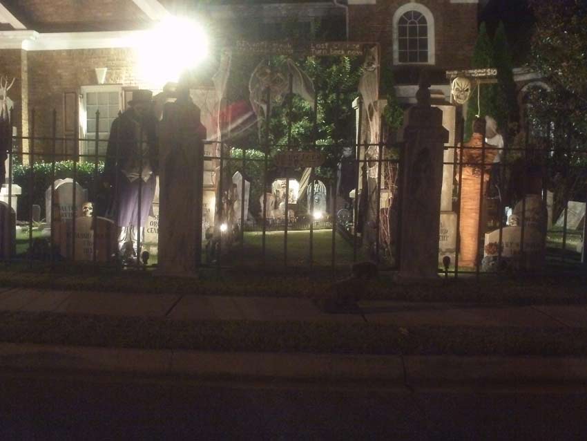 Night View of Halloween Graveyard Entrance Bat Skeleton Skull Orchard Cemetery