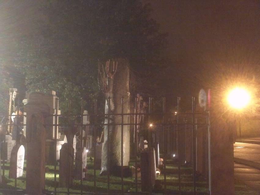 Night View of Halloween Graveyard Cemetery with Crypt Ghoul