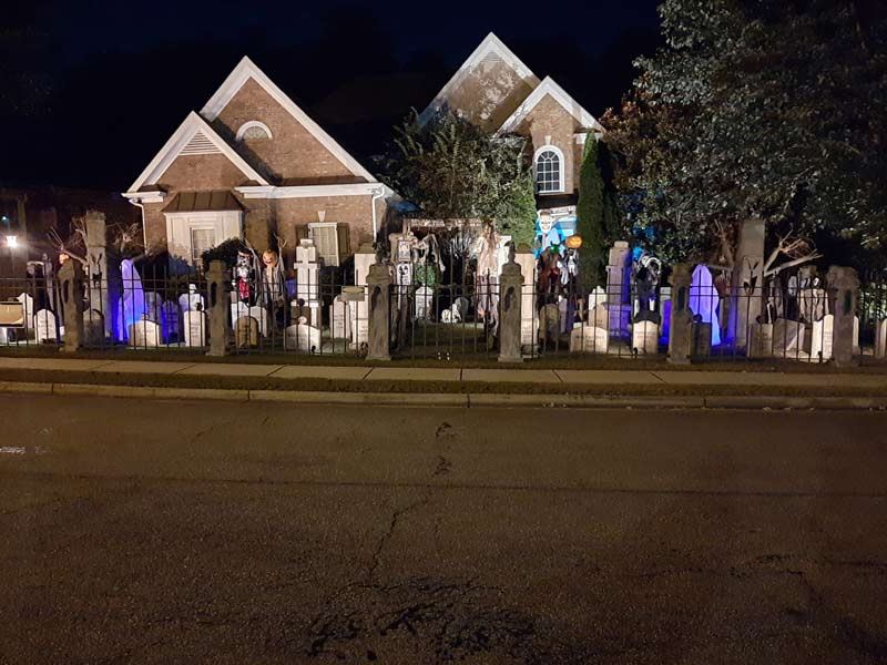 Night View of Front Gate Entrance to Halloween Graveyard Cemetery