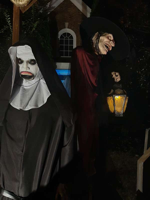 Night Front View of Halloween Graveyard Cemetery with Tombstones and Sleepy Hallow Scarecrow