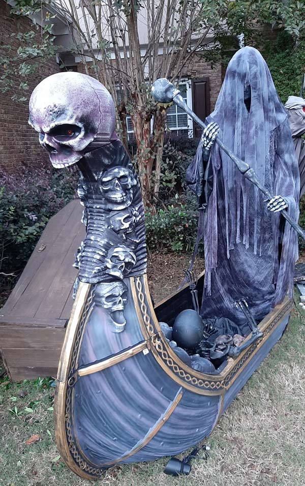 Night Side View of Halloween Graveyard Skull Orchard Cemetery with Tombstones, Tree and Spirit