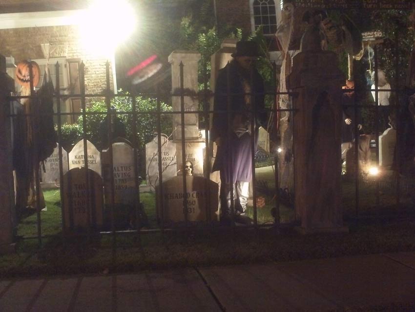 Night View of Front Gate Entrance to Halloween Graveyard Cemetery