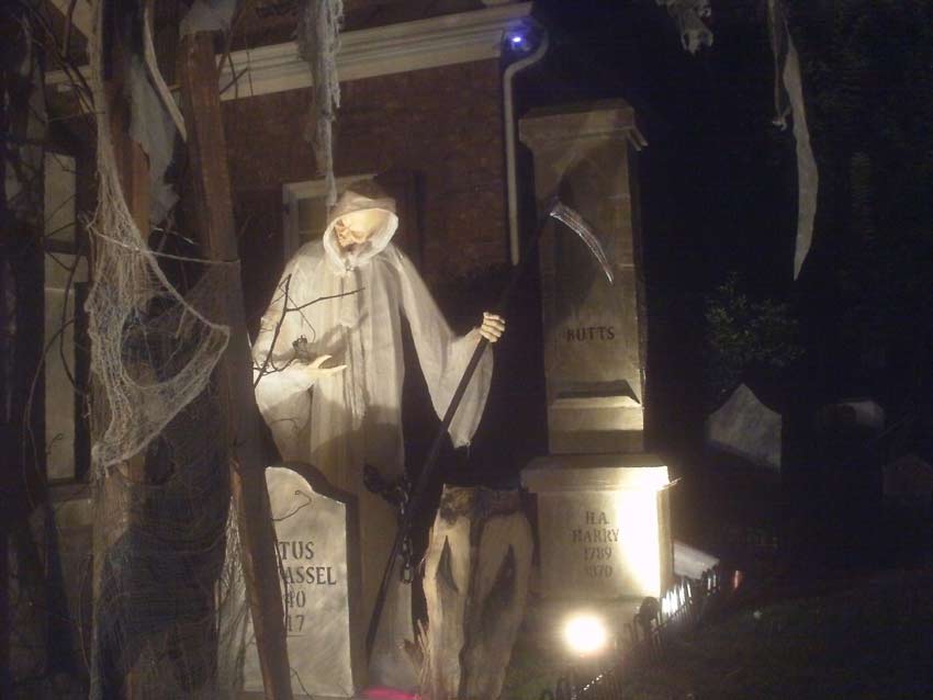 Night View of Front Gate Entrance to Halloween Graveyard Cemetery